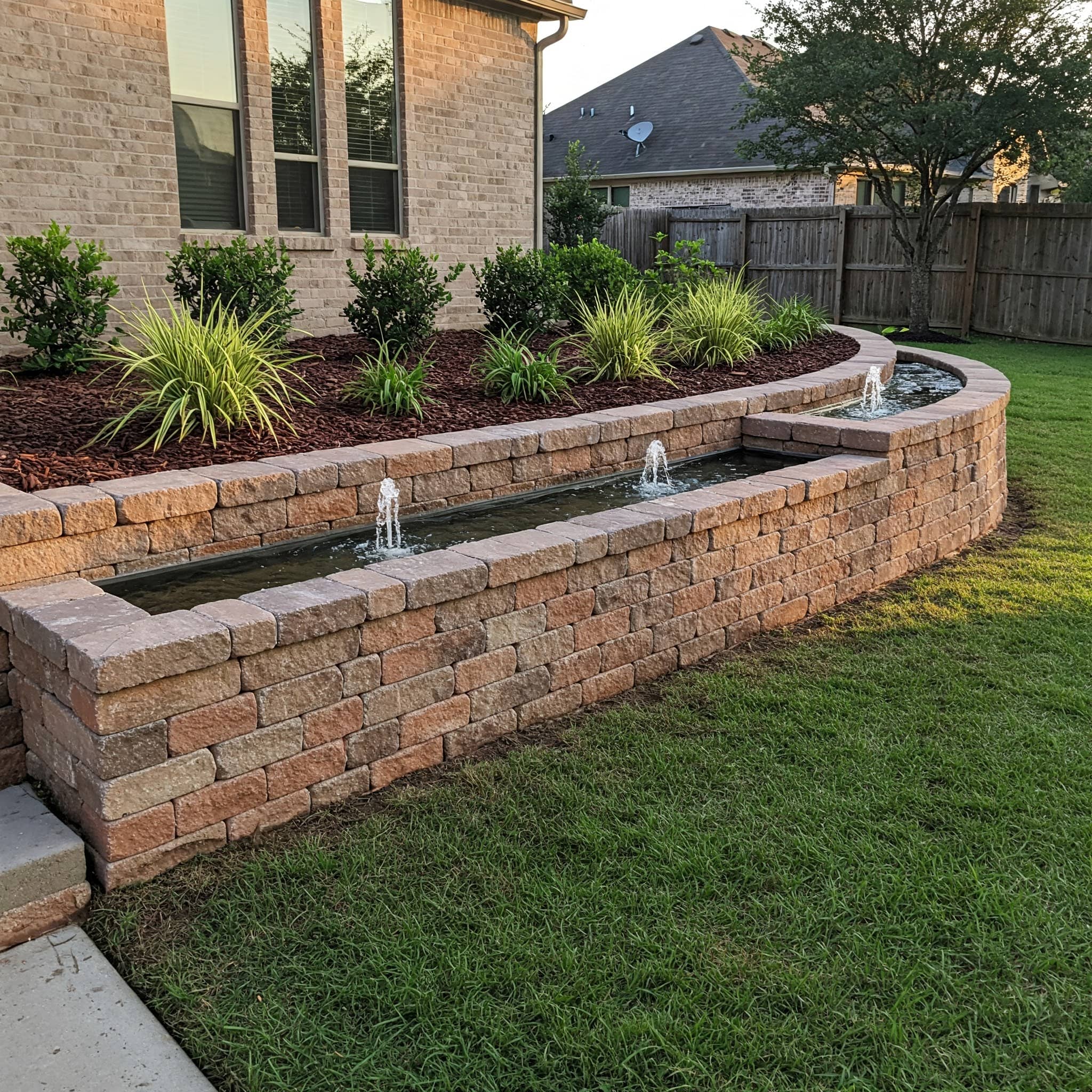 Water feature retaining wall