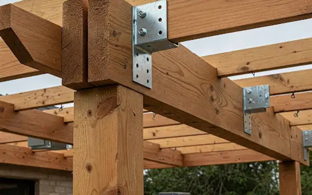 Close-up of cedar post and beam framing with galvanized metal brackets