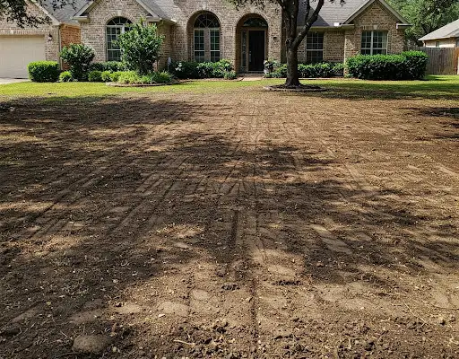 Front yard stripped and graded to bare soil before new sod goes down